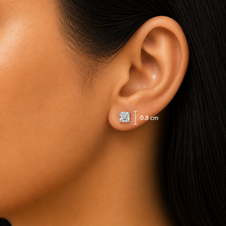 Close-up of a person's ear wearing a small square stud earring, with a measurement overlay indicating 0.8 cm height.