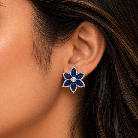 Close-up of a woman wearing a blue floral earring.