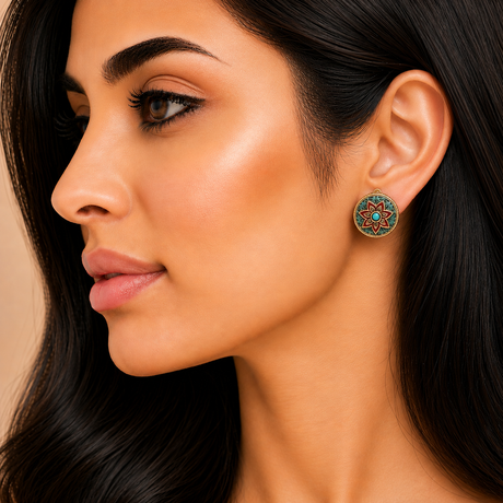 Close-up of a woman wearing a colorful earring with a neutral background