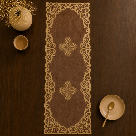 Decorative table runner with intricate gold patterns on a wooden table.
