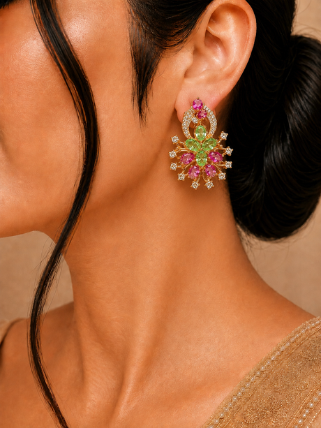Close-up of a person wearing a colorful floral earring with a neutral background