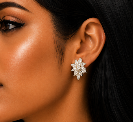 Close-up of a woman's ear wearing a diamond earring with a blurred background