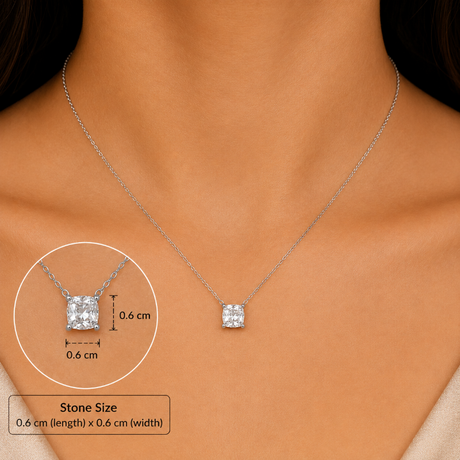 A silver chain necklace with a square bezel-set clear gemstone pendant worn on a model's neck, with an inset diagram showing the pendant dimensions as 0.6 cm by 0.