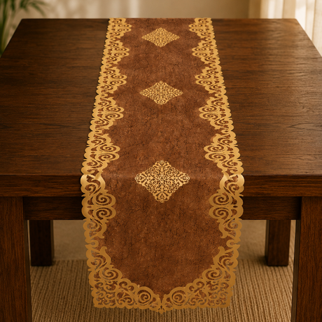 Decorative table runner with gold patterns on a wooden table.