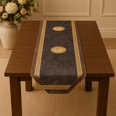 Decorative table runner with gold patterns on a wooden table in a room setting.