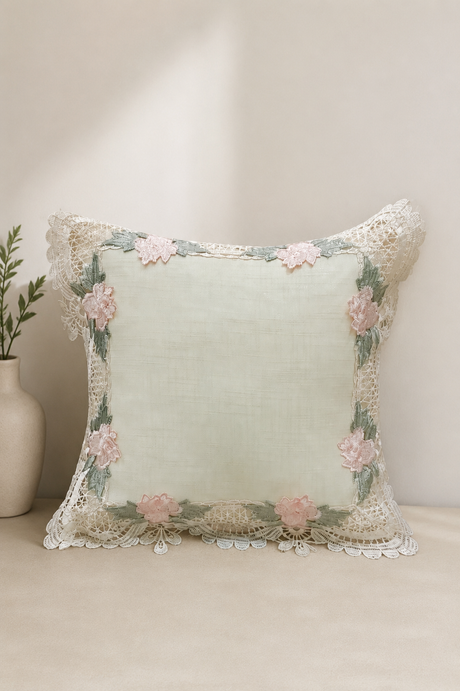 Decorative pillow with floral embroidery on a neutral background