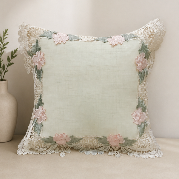 Decorative pillow with floral embroidery on a neutral background