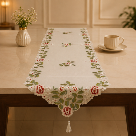 Decorative table runner with floral pattern on a table in a home setting.