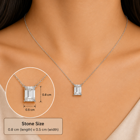 A silver-toned necklace with an emerald-cut clear stone pendant is shown on a model's neck. A circular inset highlights the pendant, and a text box at the bottom states the stone size as 0.