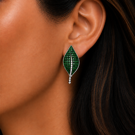 Close-up of a woman wearing a green leaf-shaped earring.