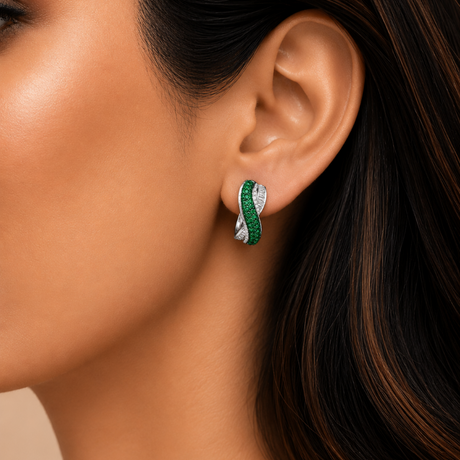 Close-up of a woman wearing a green and silver earring.