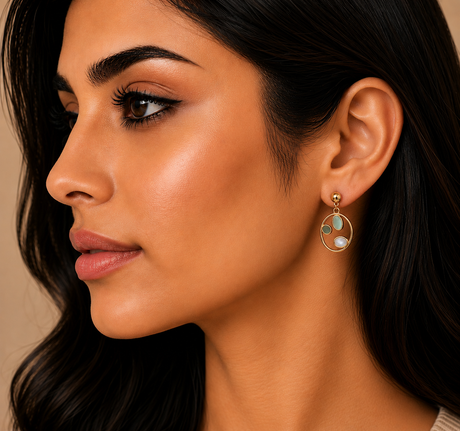 Close-up of a woman wearing an earring with a neutral background