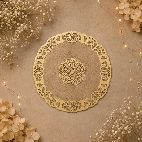 Decorative gold lace doily on a textured surface with flowers and string lights.