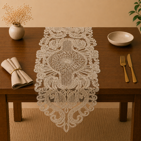 Decorative lace table runner on a wooden table with cutlery and a vase.