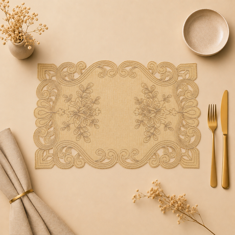 Decorative beige placemat with intricate patterns on a matching table setting.