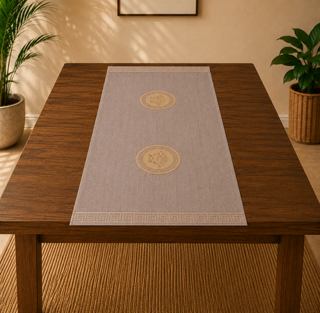 Table with a decorative table runner featuring circular designs on a wooden table.