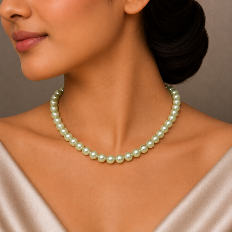 Pearl necklace worn by a model against a neutral background