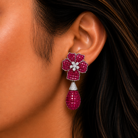Close-up of a woman's ear wearing a pink floral earring.