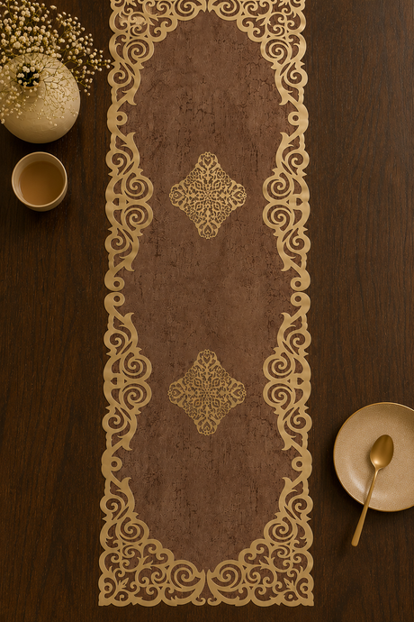 Decorative table runner with intricate gold patterns on a wooden table.