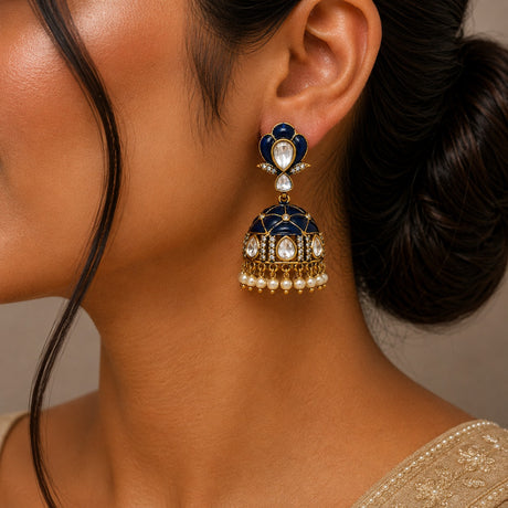 Close-up of a woman wearing a decorative earring with intricate design.