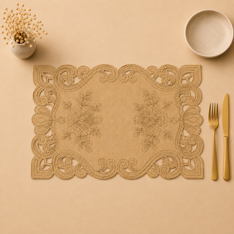Decorative placemat with floral patterns on a beige surface with cutlery and a small plant.