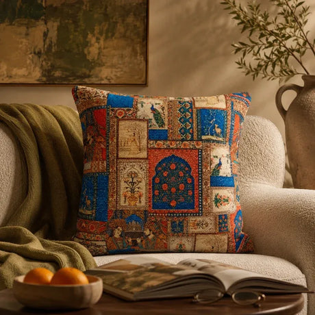 Mughal patchwork print cushion cover on a cream armchair with an olive throw, styled in a warm heritage living room